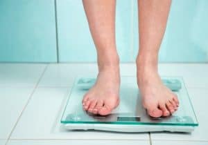 woman weighing in bathroom