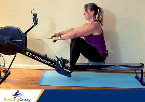 Laura Tanley working out on a Concept 2 rowing machine working all the major muscle groups including her upper body