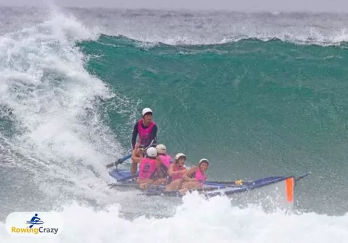 Olympic Rower Rachael Taylor and her team winning Manly Surf Carnival, shown here surf boat rowing on an enormous wave, Australia